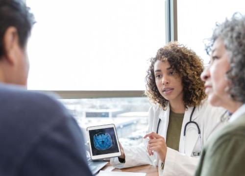 Doctor going over brain scan with patients