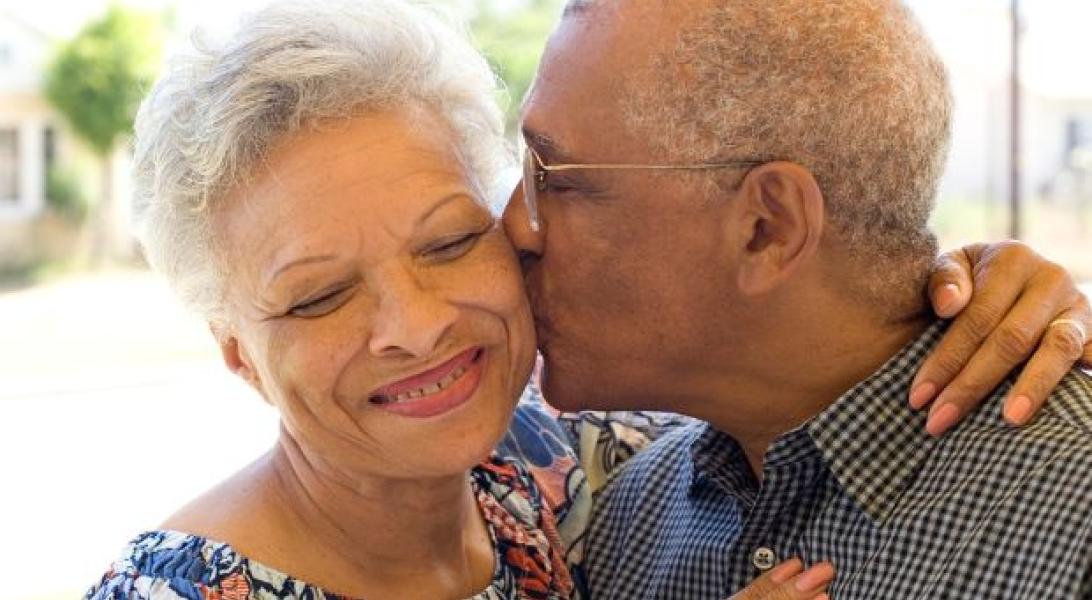 Husband kissing his wife on the cheek