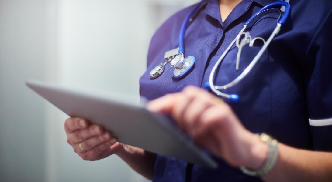 Doctor or nurse checking patient documents