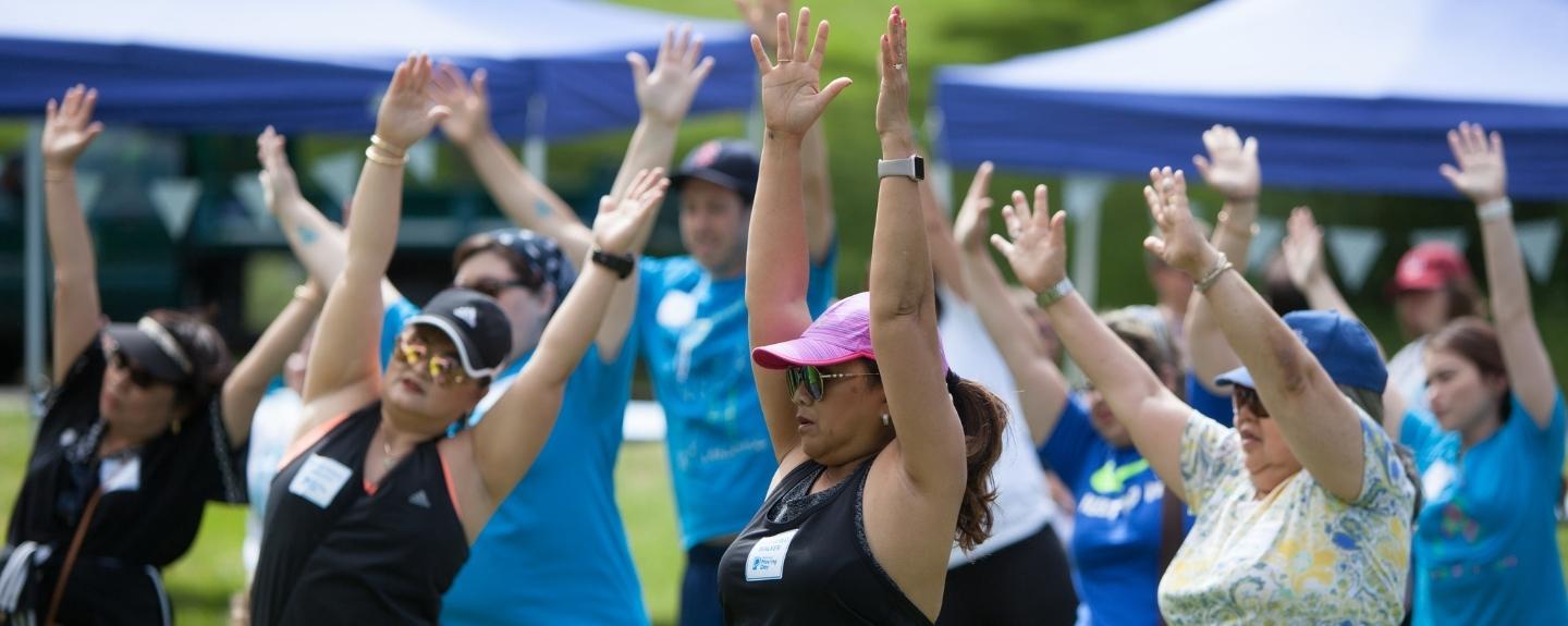 Group of people exercising at Moving Day