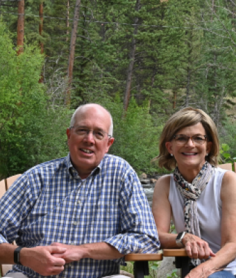 Rick and Susan Kastner sitting outside.