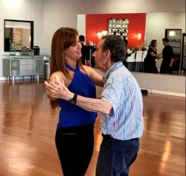 Woman and man dancing during a class