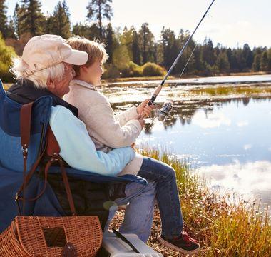 Grandpa fishing with his grandson