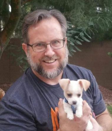 Mark Milow holding a puppy