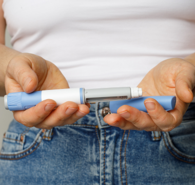 Person holding ozempic injection pen