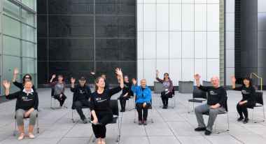 Group of people doing yoga sitting down