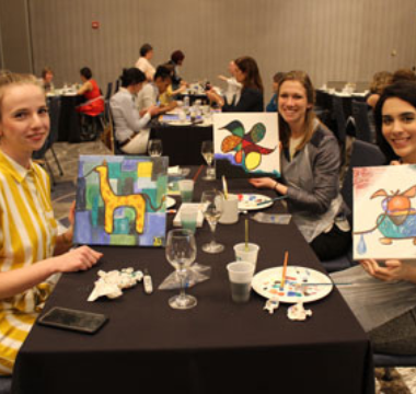 group of women doing paint night