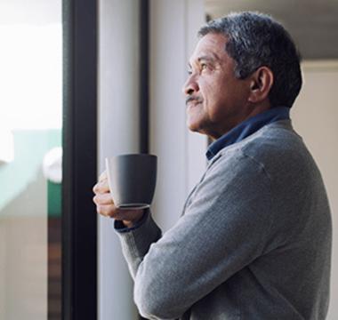 Man staring out the window