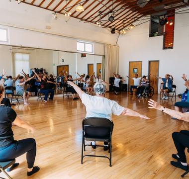 Group of people exercising at class