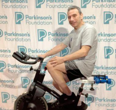 Paolo Tatafiore riding an exercise bike for Revolution 2022