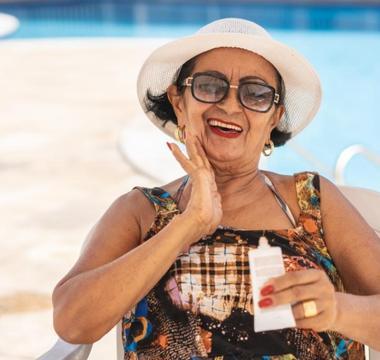 Woman applying sunscreen