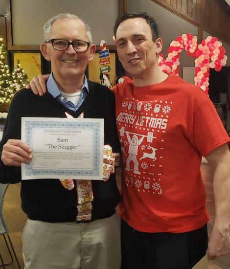 Two men accepting award