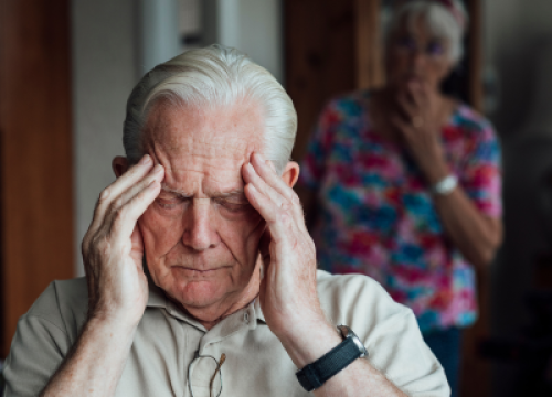 Man distressed with head in hands
