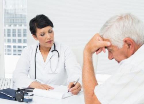 Doctor explaining reports to patient