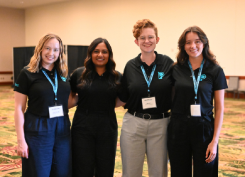 Group of four PD staff posing for a picture