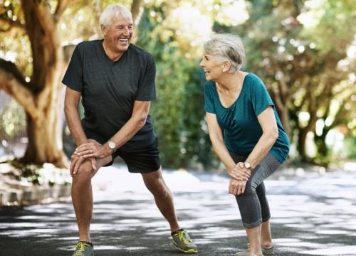 Couple outdoors stretching