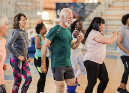 Group of people dancing at exercise class