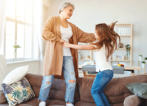 Grandmother dancing with granddaughter