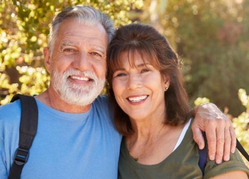 Couple hugging while hiking