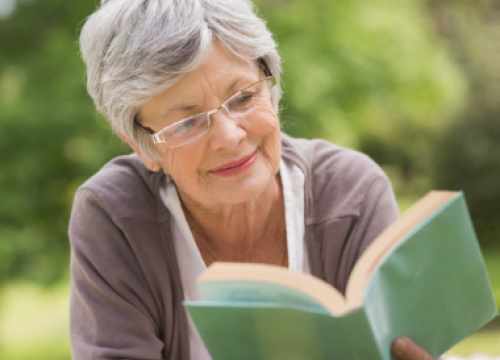 Woman reading a book outside