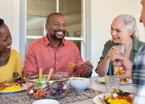 Family and friends sharing a meal around a table