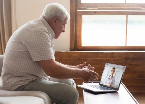 Man on computer for a doctor appointment