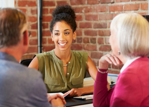 Couple talking to a woman professional