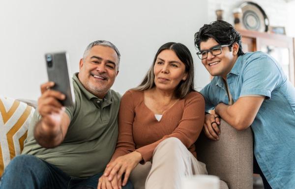 Family of three taking a selfie together