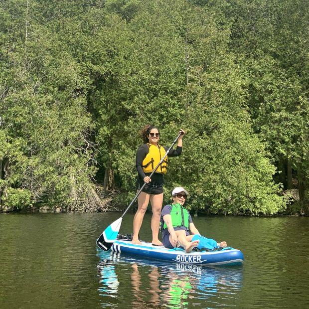 Carla paddleboarding with daughter