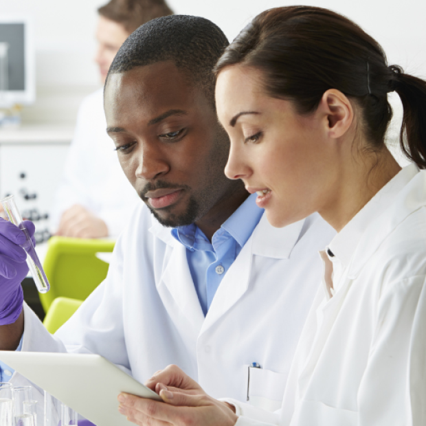 Two scientists working together in the lab