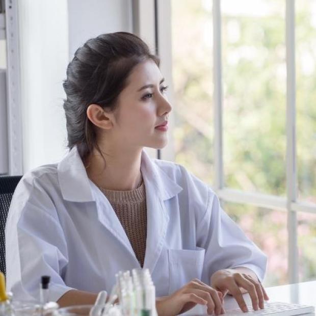 Medical professional looking at computer