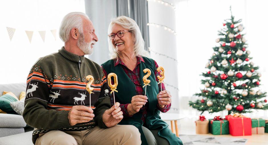 Couple holding 2-0-2-3 signs