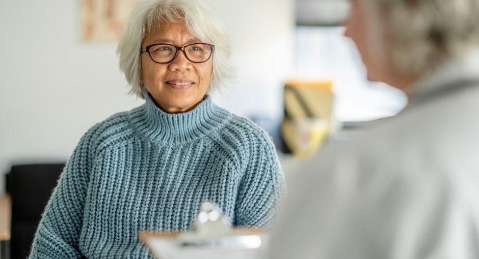 Woman talking to health advisor