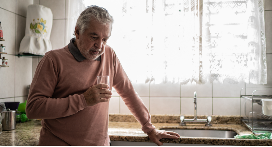 Man leaning on counter