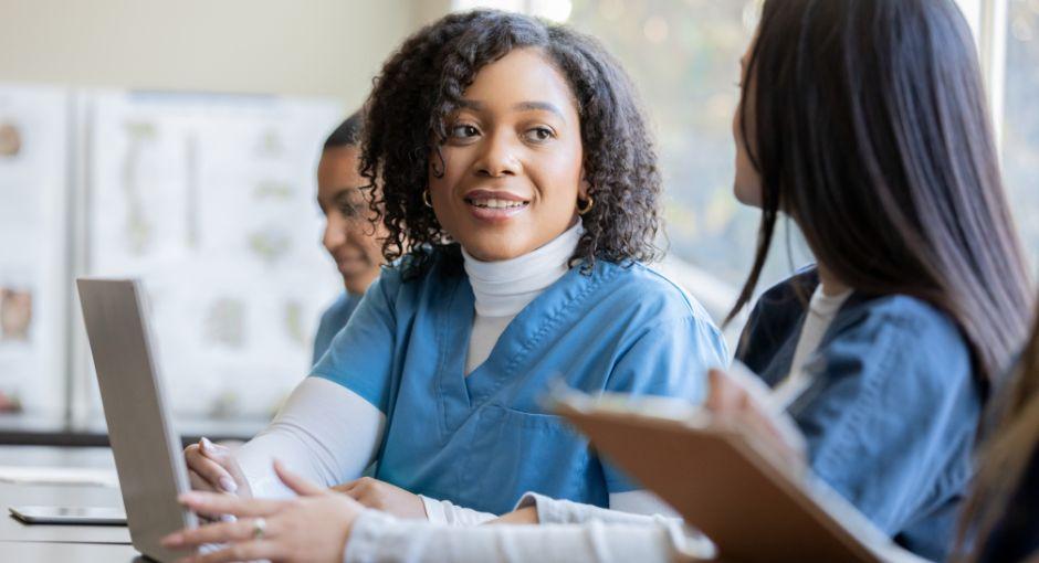 Three female nurses learning