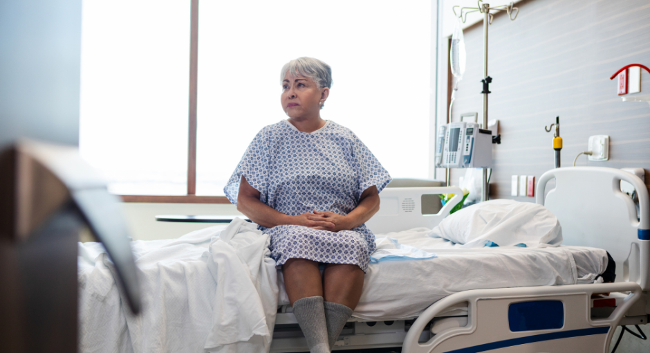 Woman sitting on hospital bed