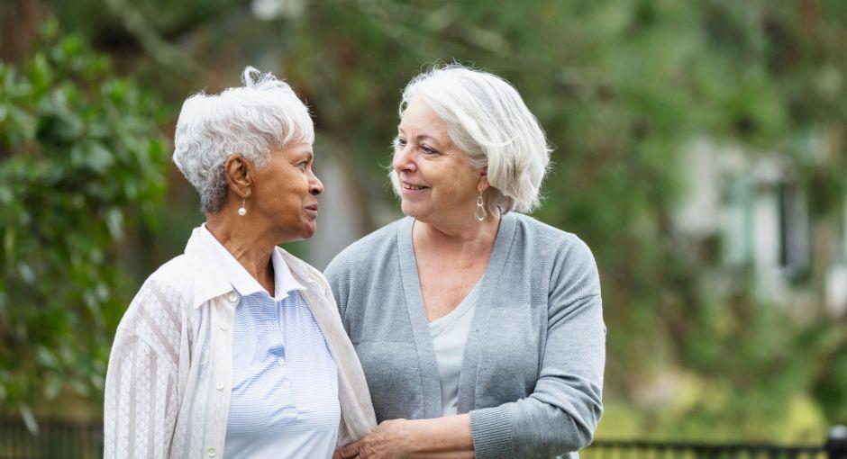 Two friends walking together, showing support