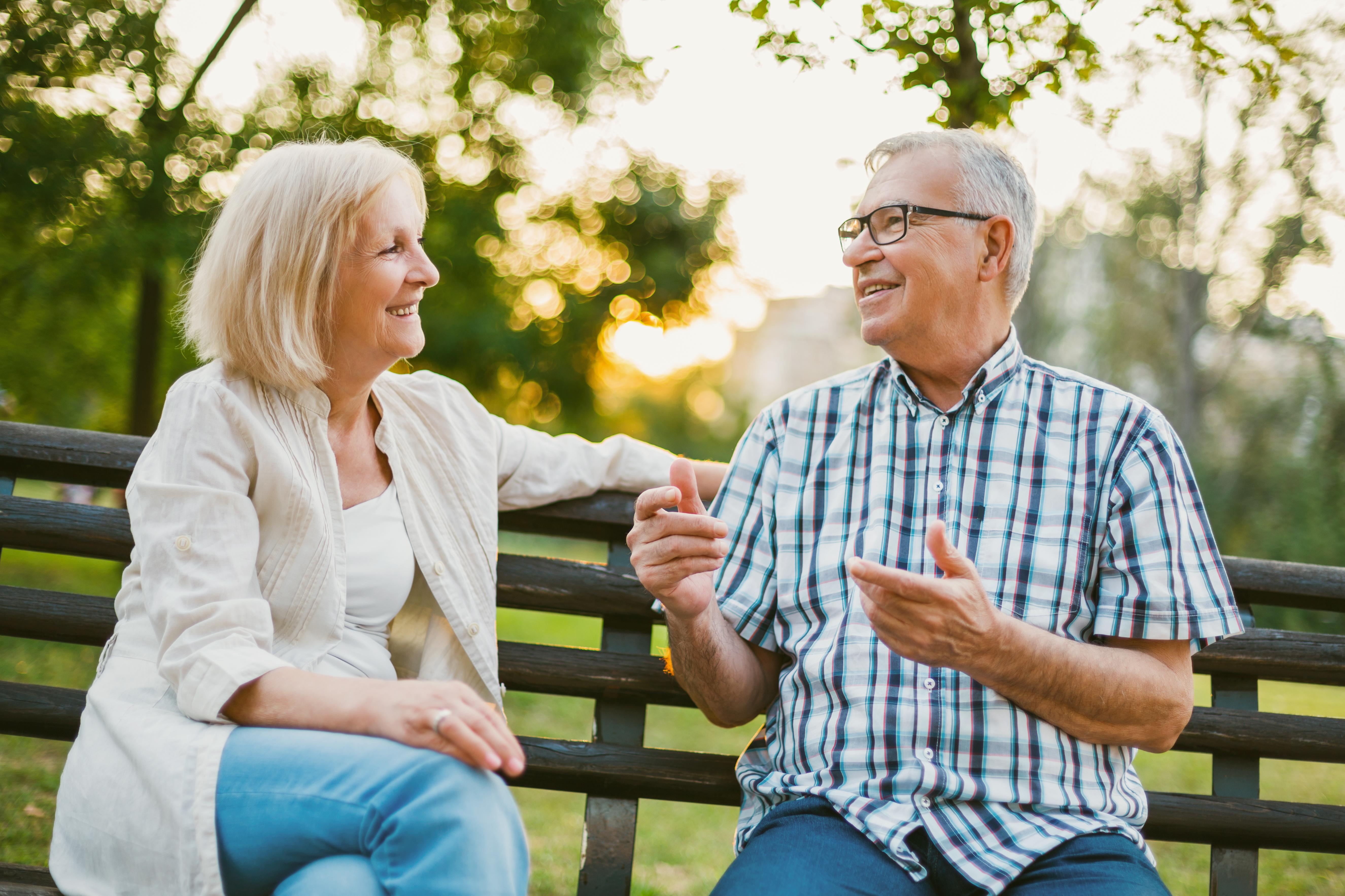 couple talking on a bench