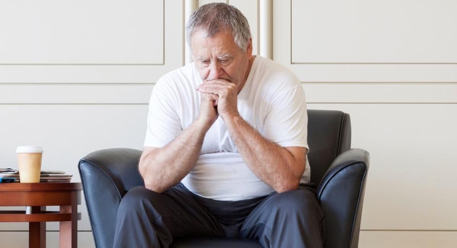 Man sitting on chair and thinking