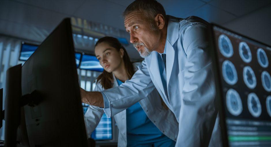 Two doctors looking at brain xrays