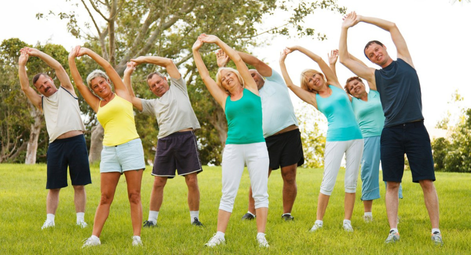 Group of people stretching outside