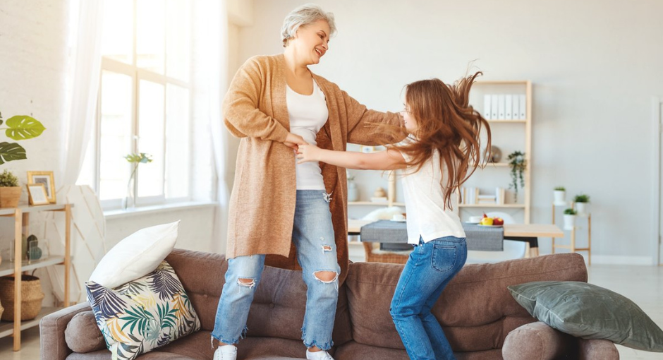 Grandmother dancing with granddaughter