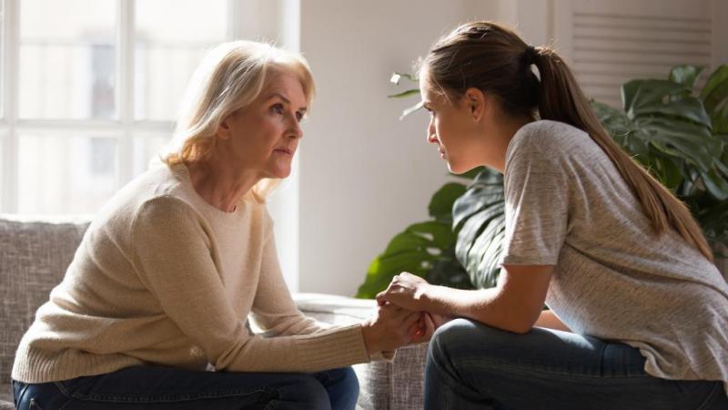 Woman talking to her daughter