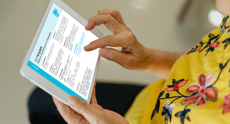 Woman reading PF fact sheet on tablet