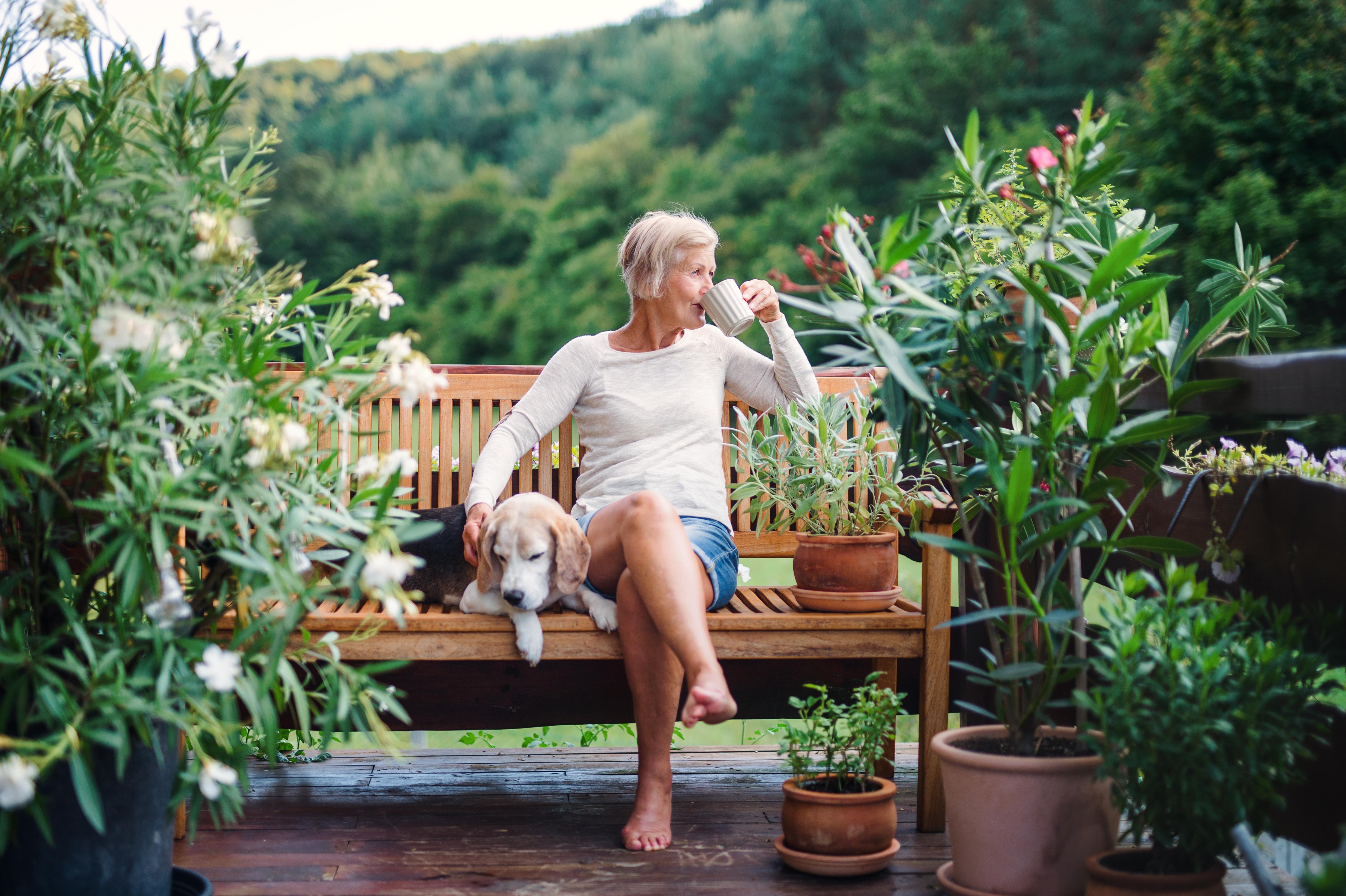 Woman sitting on a bench outside