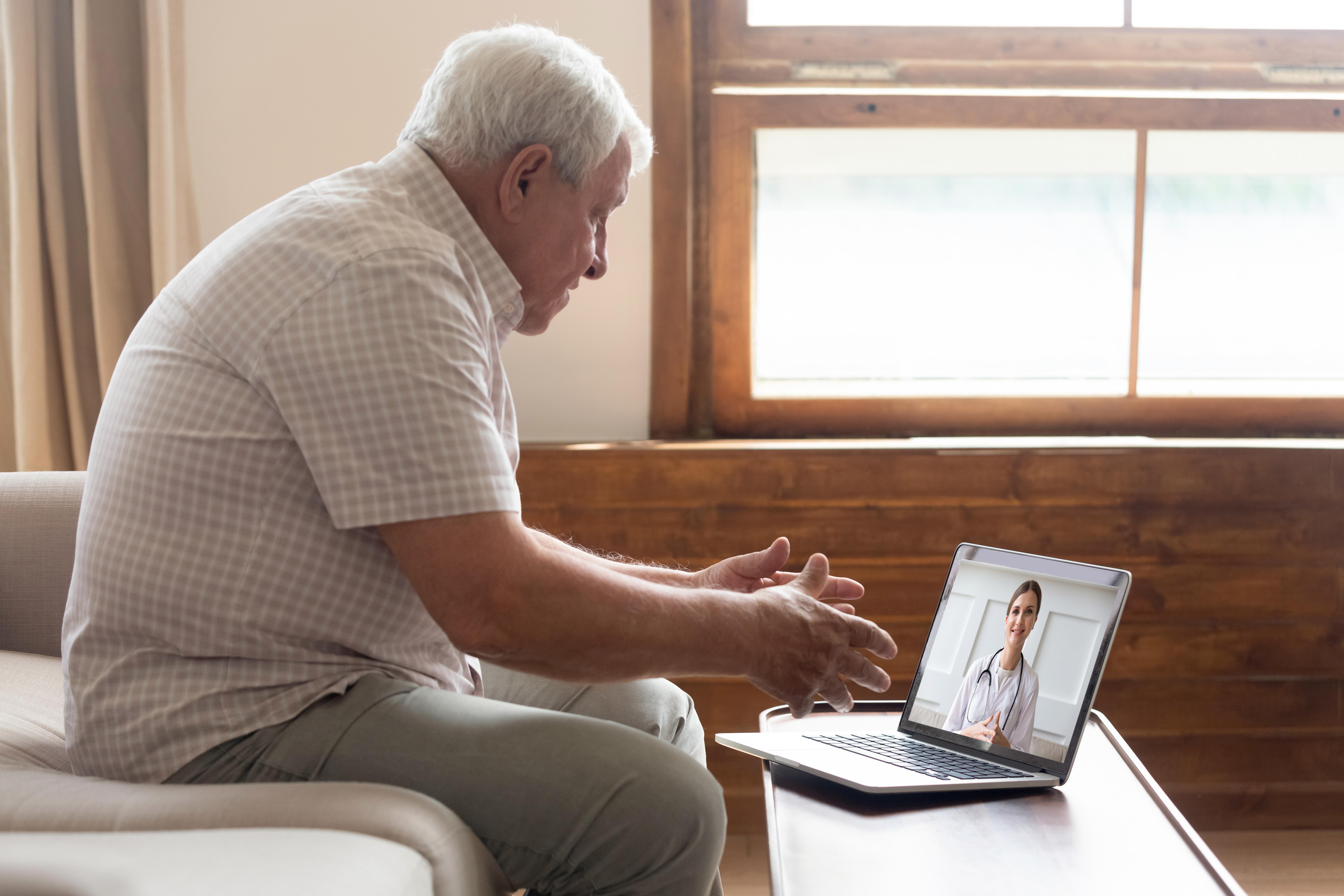 Man on computer for a doctor appointment