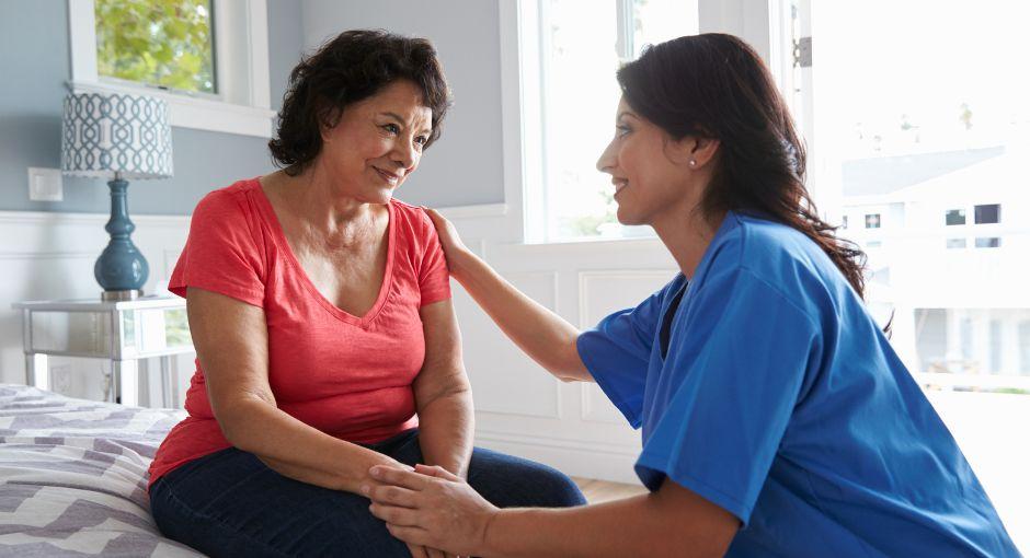 Two women talking; they clearly are fond of each other