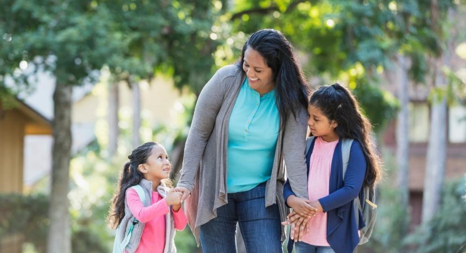 Multigenerational family of women walking while enjoying each other's company